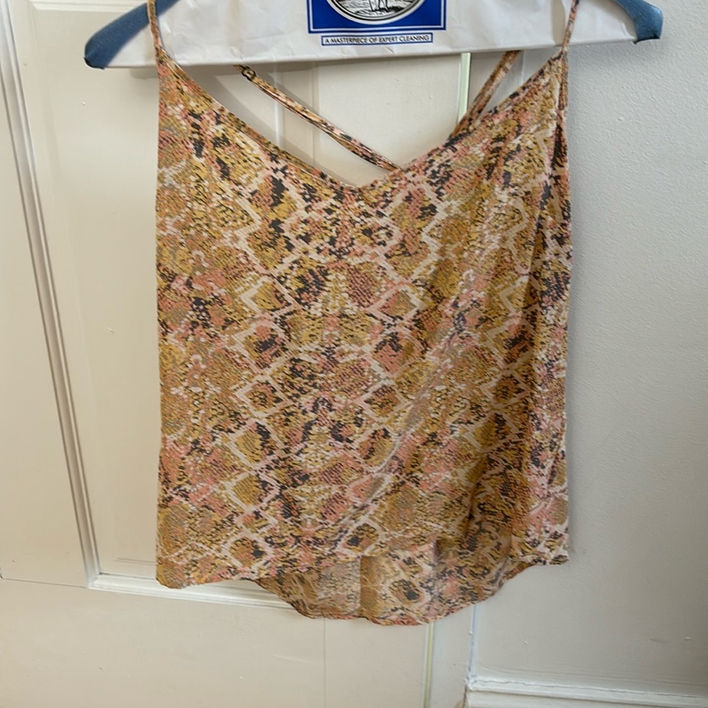 Pink sleeveless racerback blouse